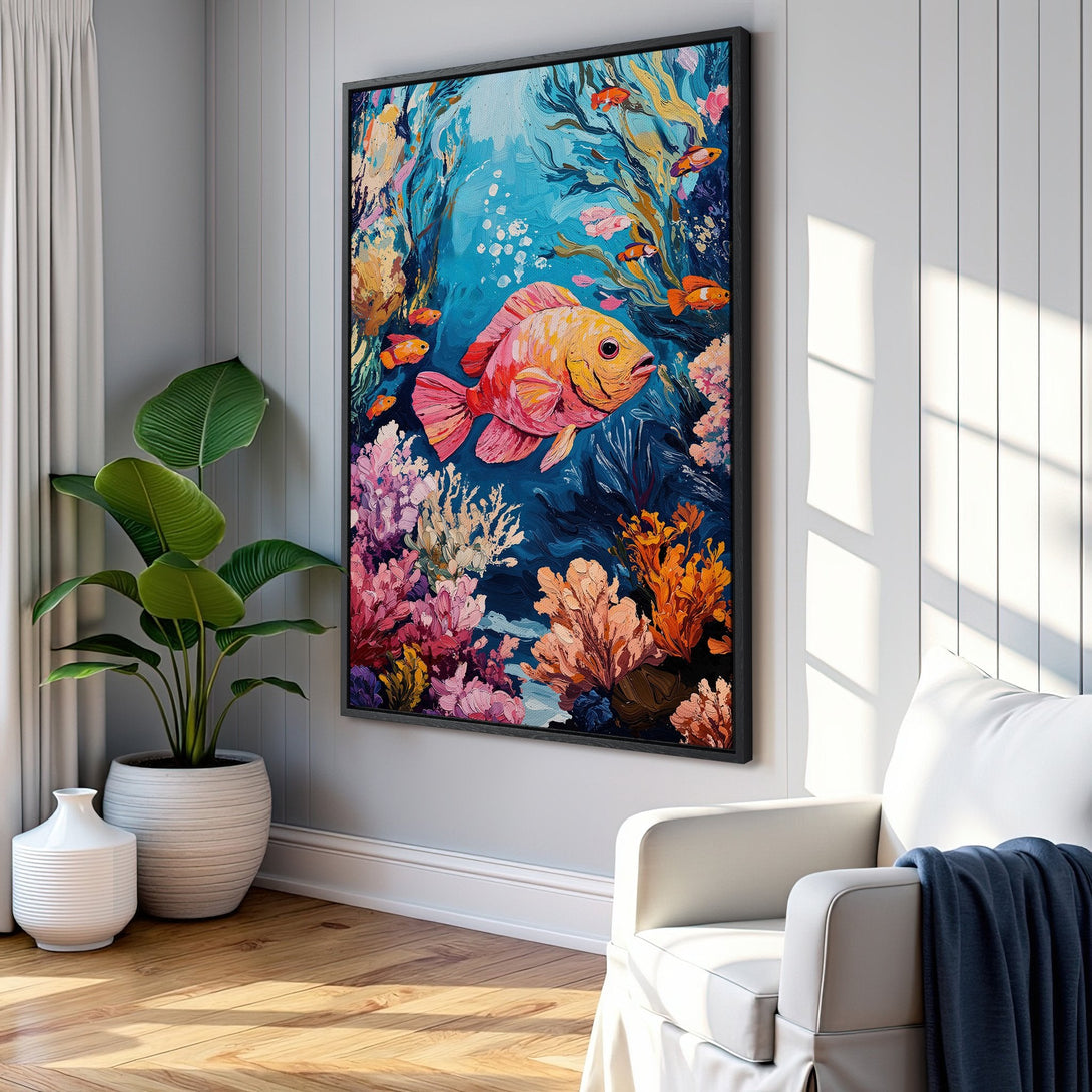 Framed Wall Art featuring a vibrant, impressionistic underwater scene with a large fish. Colorful palette of blues, pinks, and oranges adds a pop of coastal style to any room.