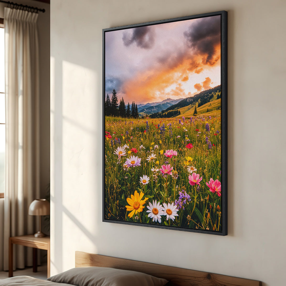 Framed Wall Art featuring a vibrant meadow landscape with colorful wildflowers under a dramatic sunset sky. Warm, inviting color palette.
