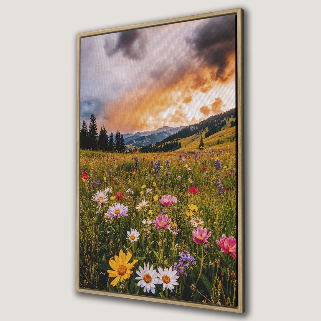 Framed Wall Art: Vibrant meadow Canvas Print with colorful wildflowers, mountains, and a dramatic sunset. Warm, inviting color palette for home decor.