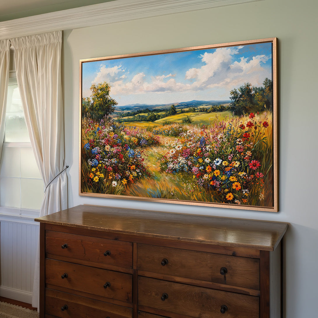 Framed Wall Art of a vibrant wildflower meadow. Impressionistic style with a warm, colorful palette of blues, yellows, and reds. Perfect for home decor.