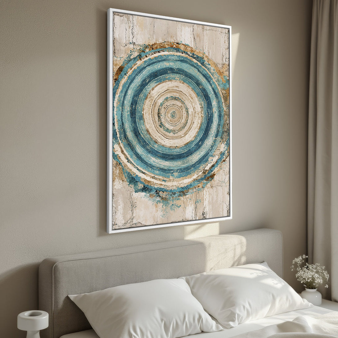 Framed Wall Art featuring abstract blue and beige concentric circles. Modern art canvas print adds a calming touch to bedroom decor.