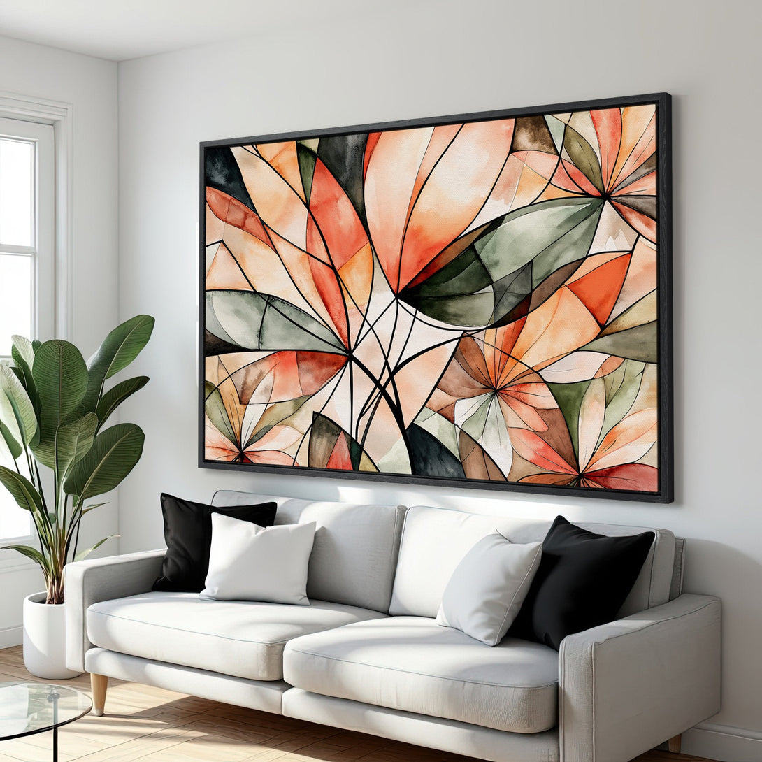 Framed Wall Art: Abstract floral design in warm orange, green, and black tones. Modern watercolor style canvas print adds a pop of color to any living room.