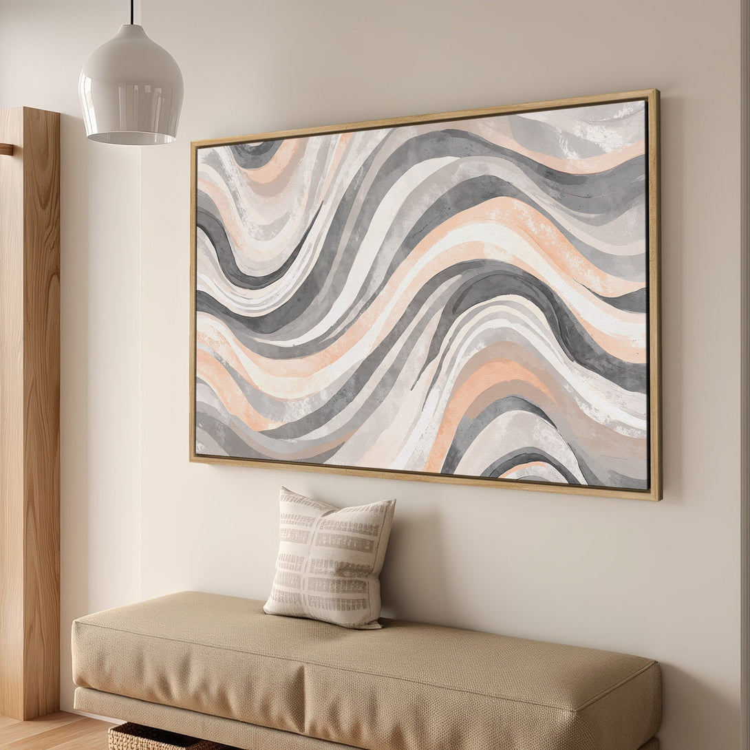 Framed Wall Art featuring an abstract wave design in neutral tones of gray, peach, and white. Modern art for any space.