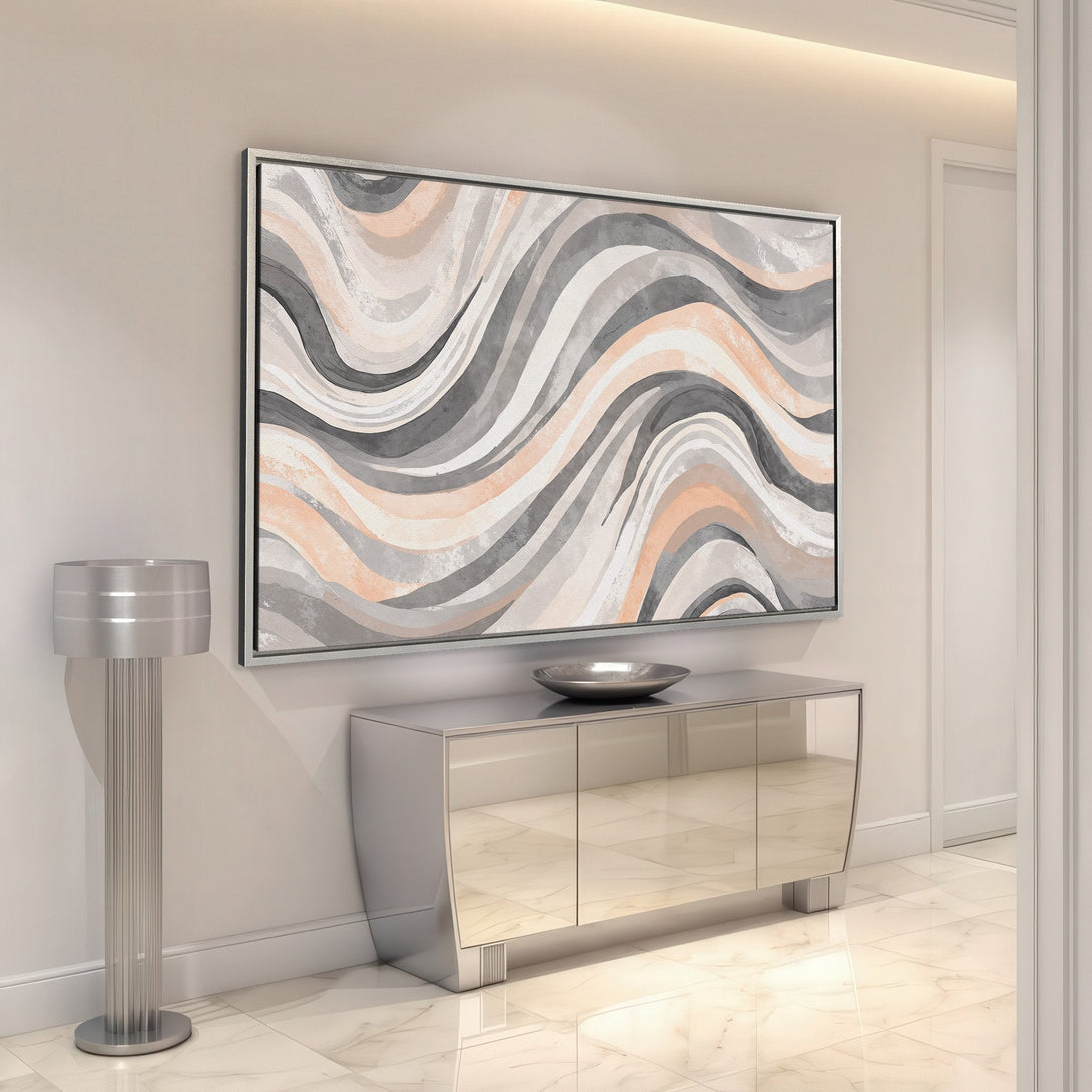 Framed Wall Art featuring an abstract wave design in neutral tones of gray, peach, and white. Perfect for modern home decor.