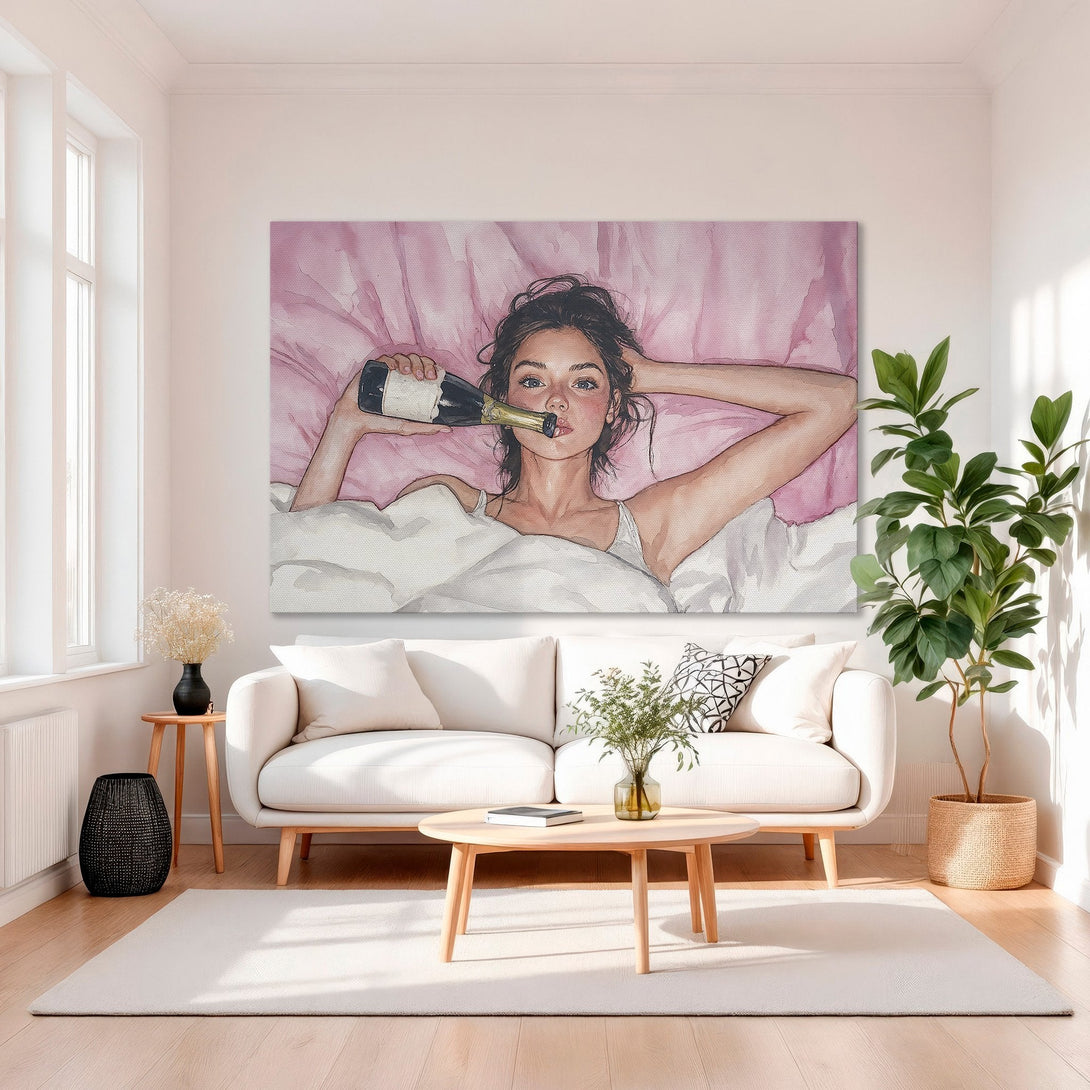 Framed Wall Art: Watercolor painting of a woman with champagne in bed, in a pink and gold color palette. Perfect for a chic, modern interior.
