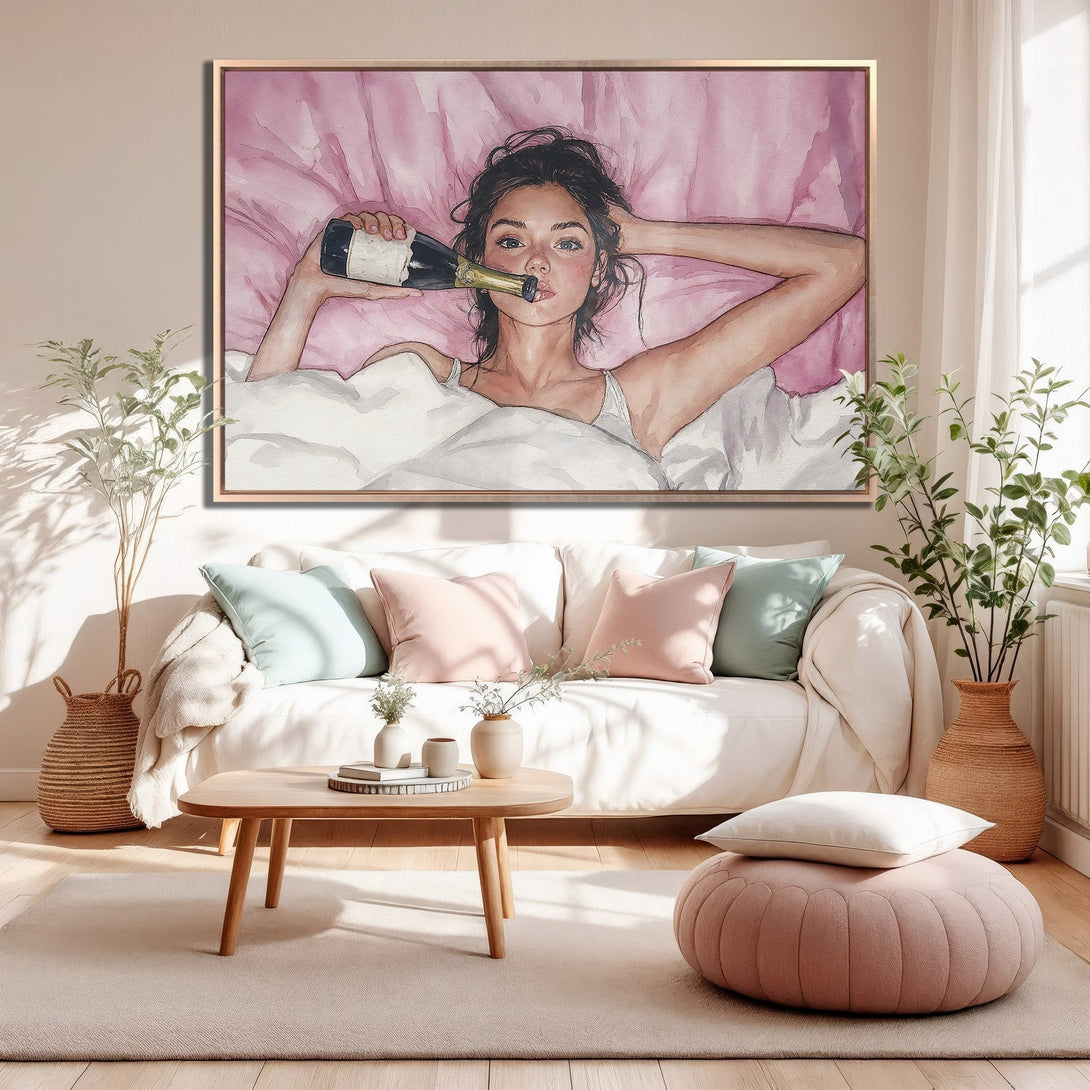 Framed Wall Art: Watercolor painting of a woman with champagne in bed. Soft pink and white color palette, perfect for bedroom decor.