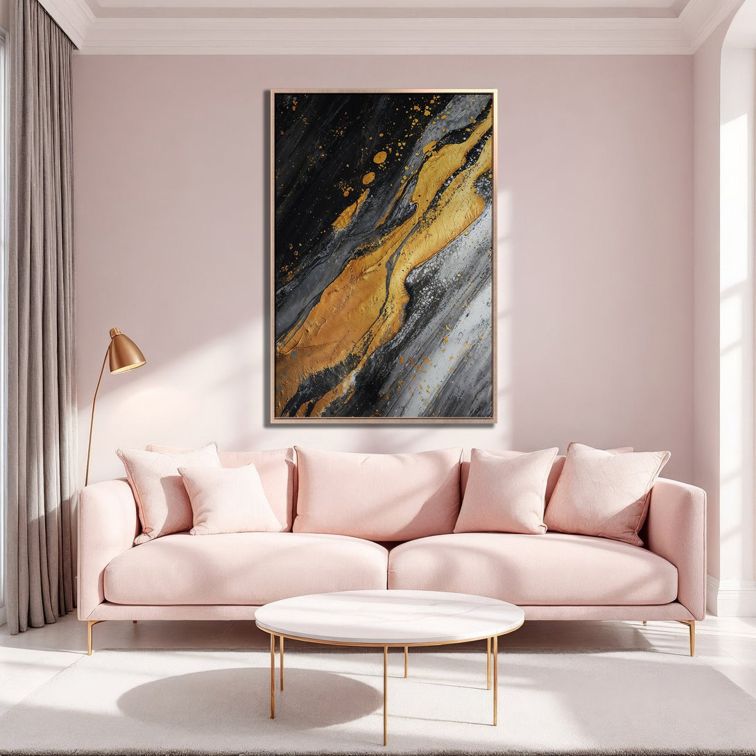 Framed Wall Art: Abstract gold, black, and gray canvas print. Modern art for living room decor. Stylish interior with pink sofa and gold accents.