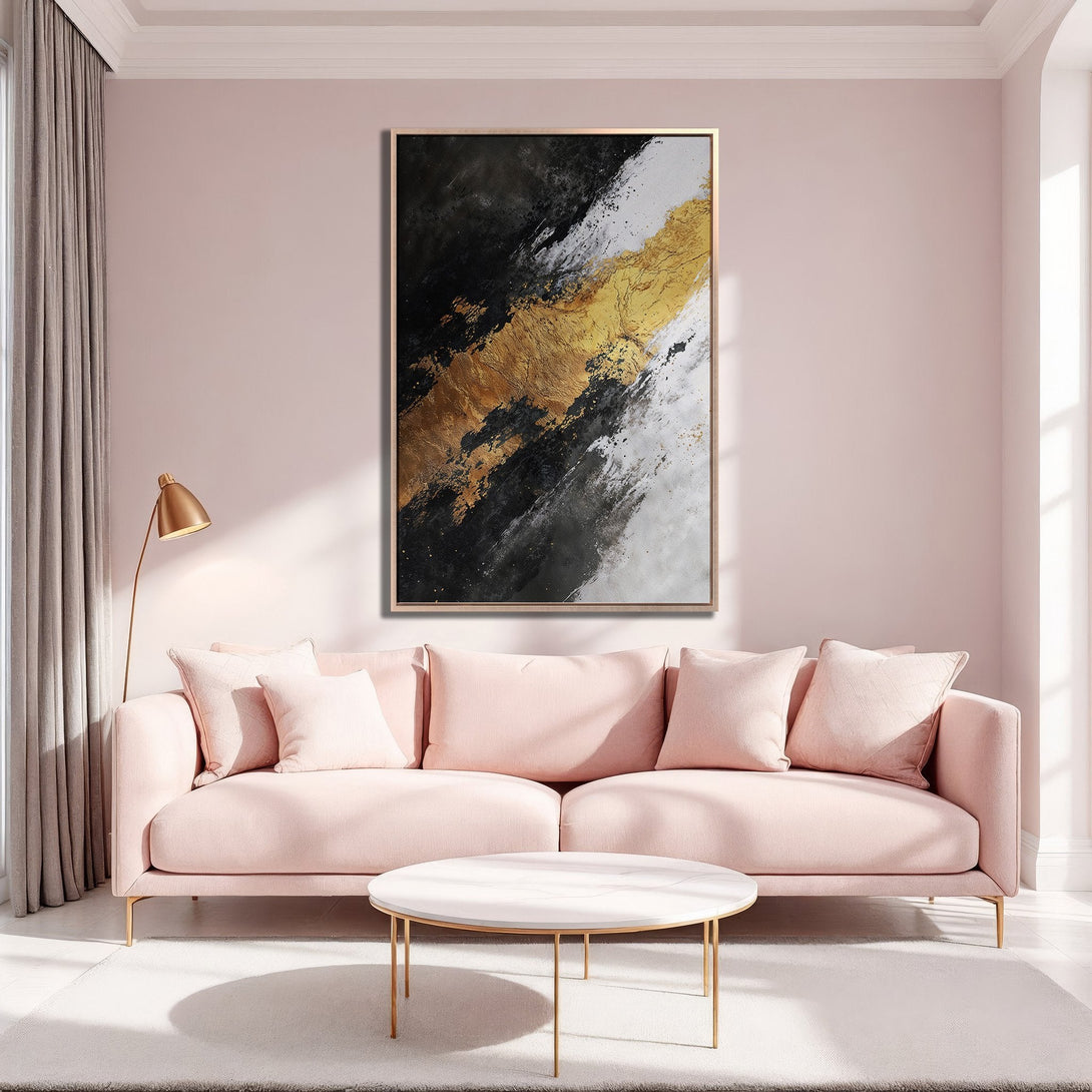 Framed Wall Art: Abstract gold, black, and white painting. Modern art canvas print adds elegance to a living room with a blush pink sofa.