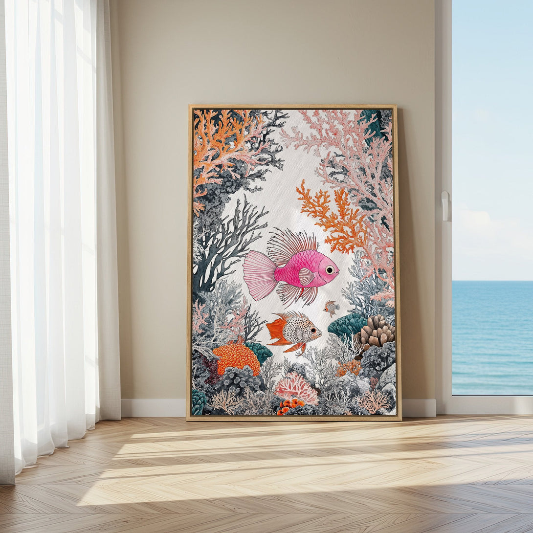 Framed Wall Art featuring vibrant coral reef and fish illustration in a modern style. Pink, orange, and teal color palette adds a coastal touch to any space.