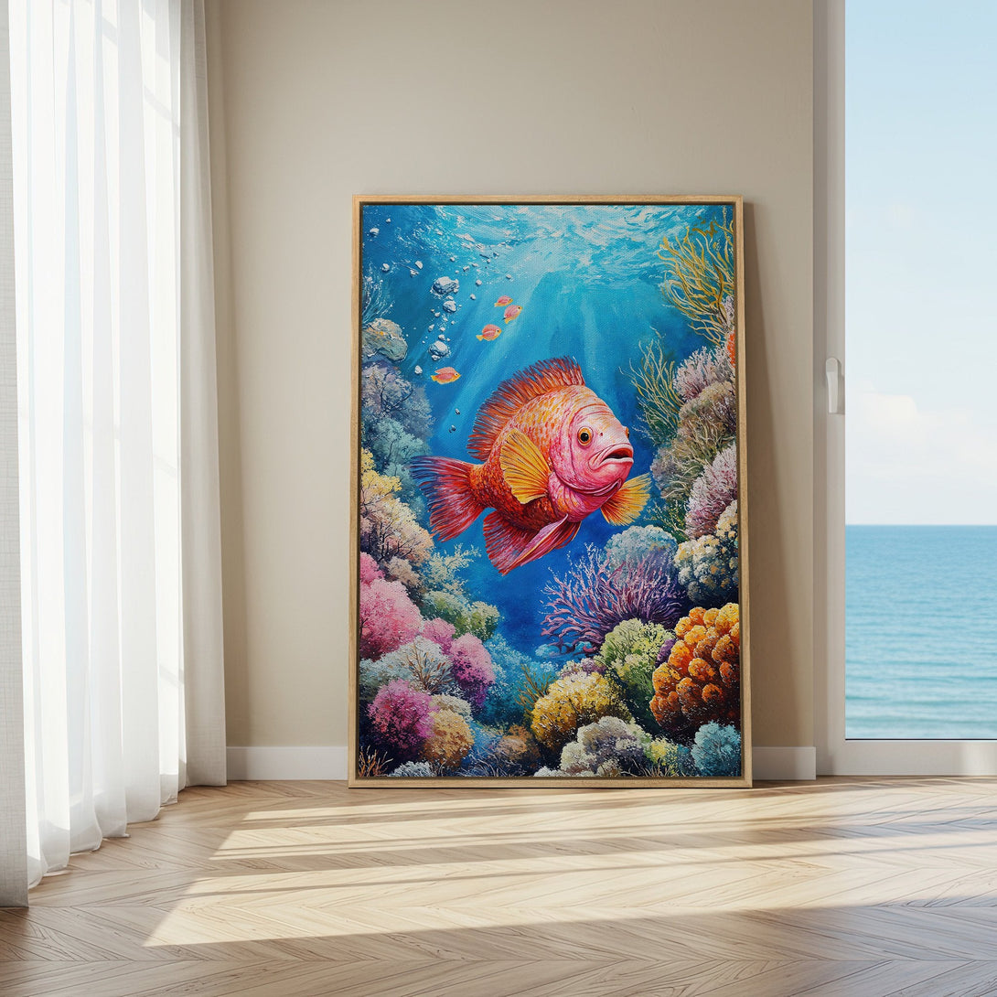 Framed Wall Art featuring a vibrant coral reef scene with a large orange fish. Beautiful blue, pink, and yellow color palette. Perfect for coastal decor.
