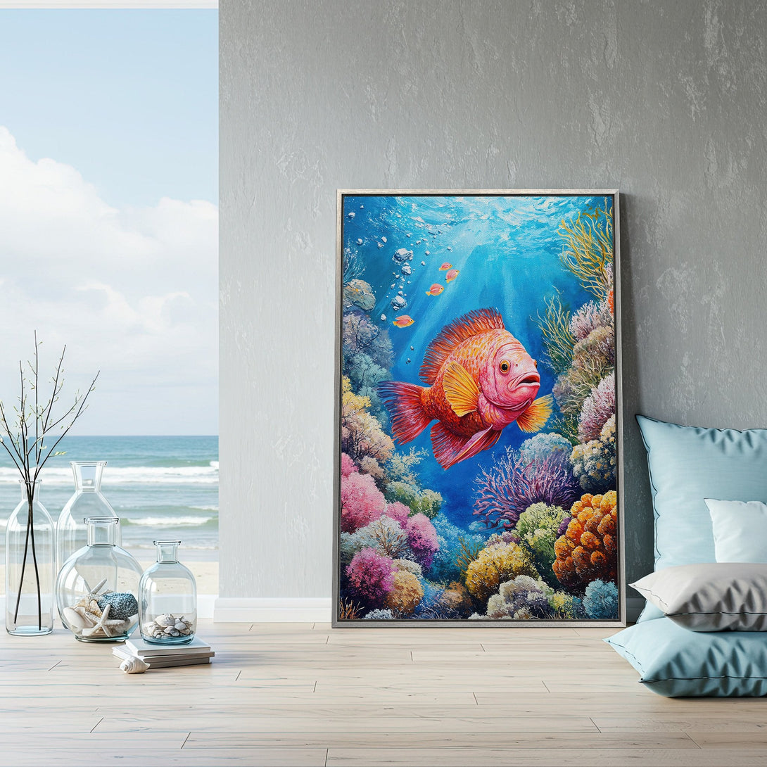 Framed Wall Art: Vibrant watercolor-style Canvas Print of a colorful fish in a coral reef. Featuring a blue, pink, and orange palette, perfect for coastal decor.
