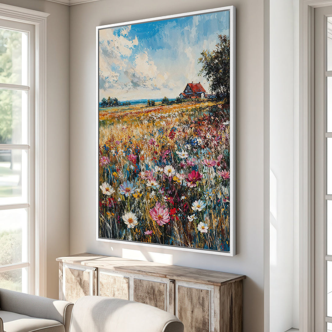 Framed Wall Art: Impressionistic landscape Canvas Print with vibrant wildflowers, a red-roofed house, and a blue sky. Warm, colorful palette adds charm.