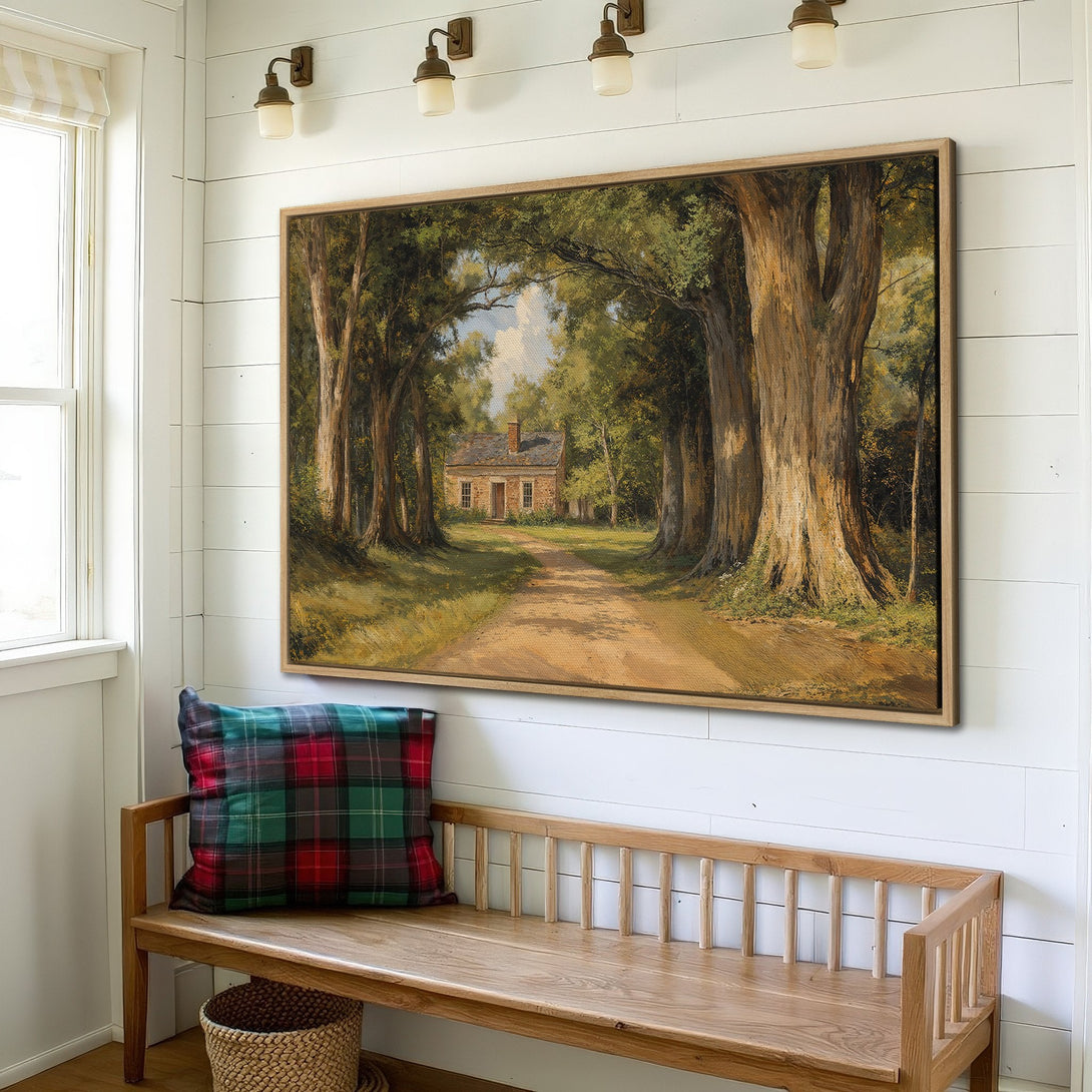 Framed Wall Art: Landscape painting of a path leading to a house, warm earth tones and greens, displayed in a cozy interior setting.