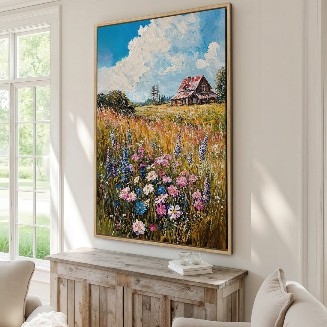 Framed Wall Art: Impressionist landscape Canvas Print with a vibrant field of wildflowers, a rustic barn, and a blue sky. Warm, inviting color palette.
