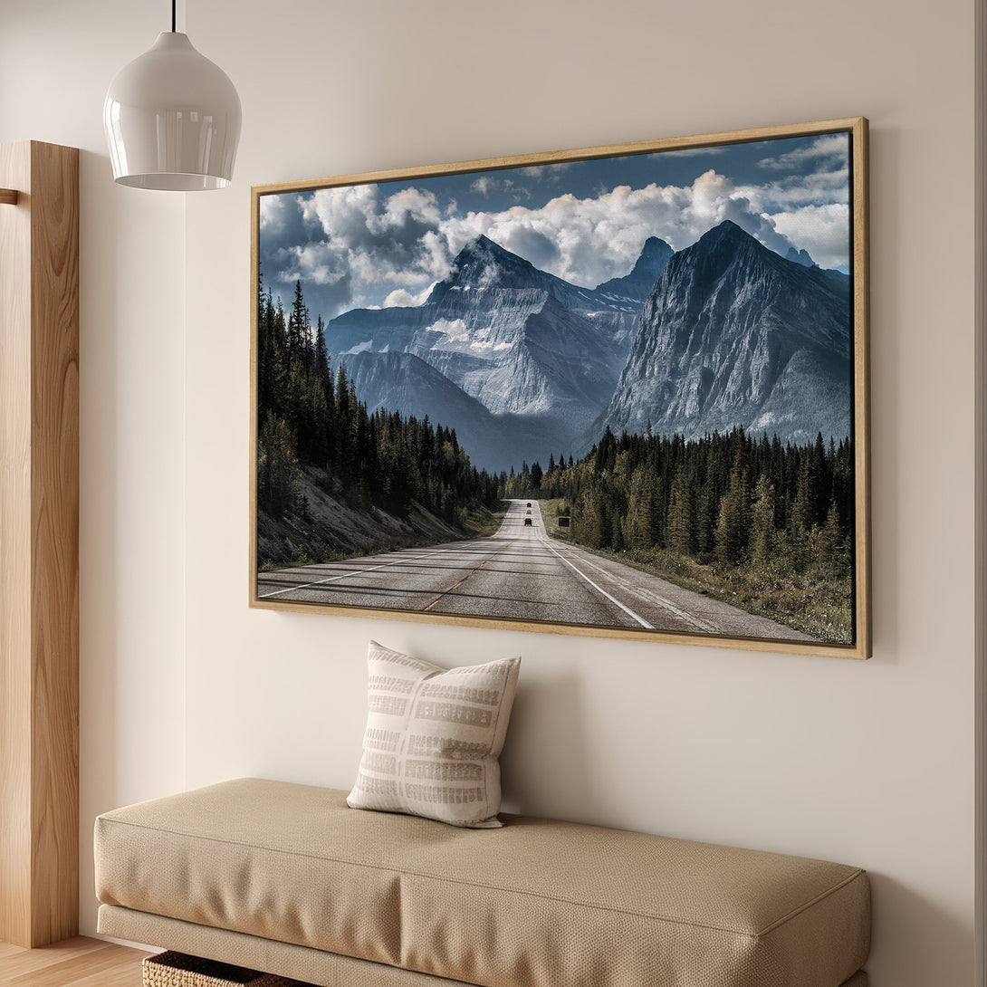 Framed Wall Art featuring a scenic mountain road. Earthy tones and cool blues create a serene landscape. Perfect for adding a touch of nature to your home.