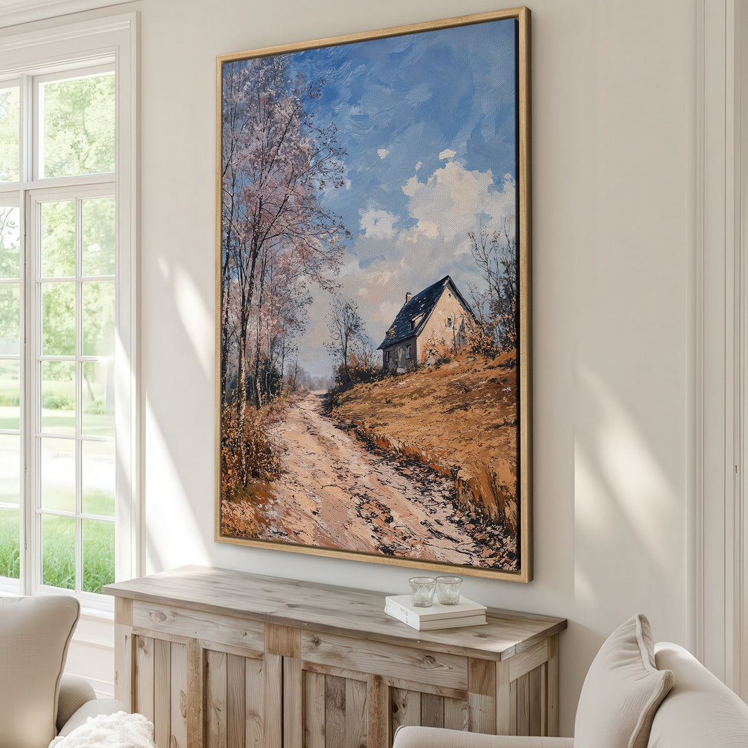 Framed Wall Art featuring a serene landscape painting with a house and road. Warm earth tones and blue sky create a calming, classic style. Perfect for home decor.