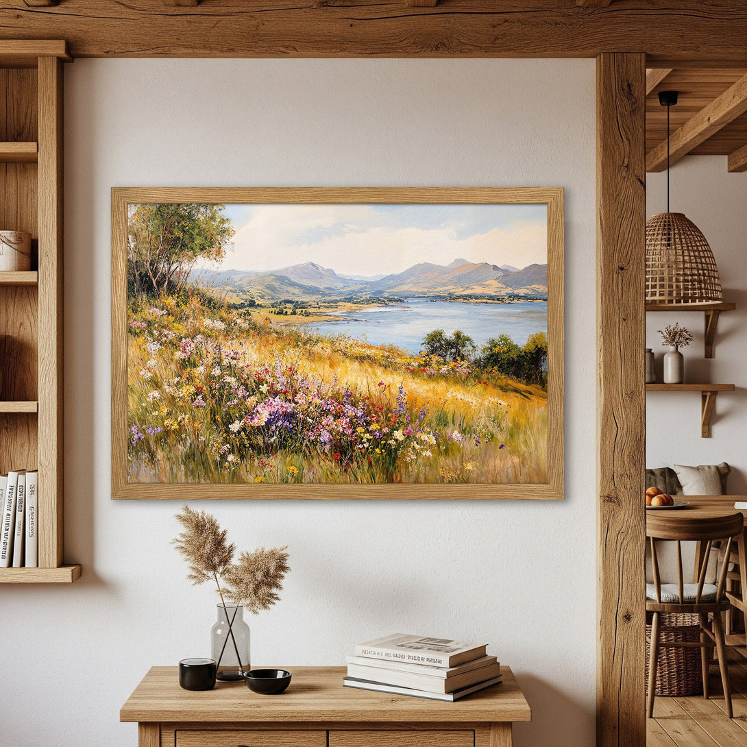 Framed Poster of a serene landscape painting, featuring a vibrant meadow and mountains. Earthy tones and warm colors create a calming, artistic vibe.