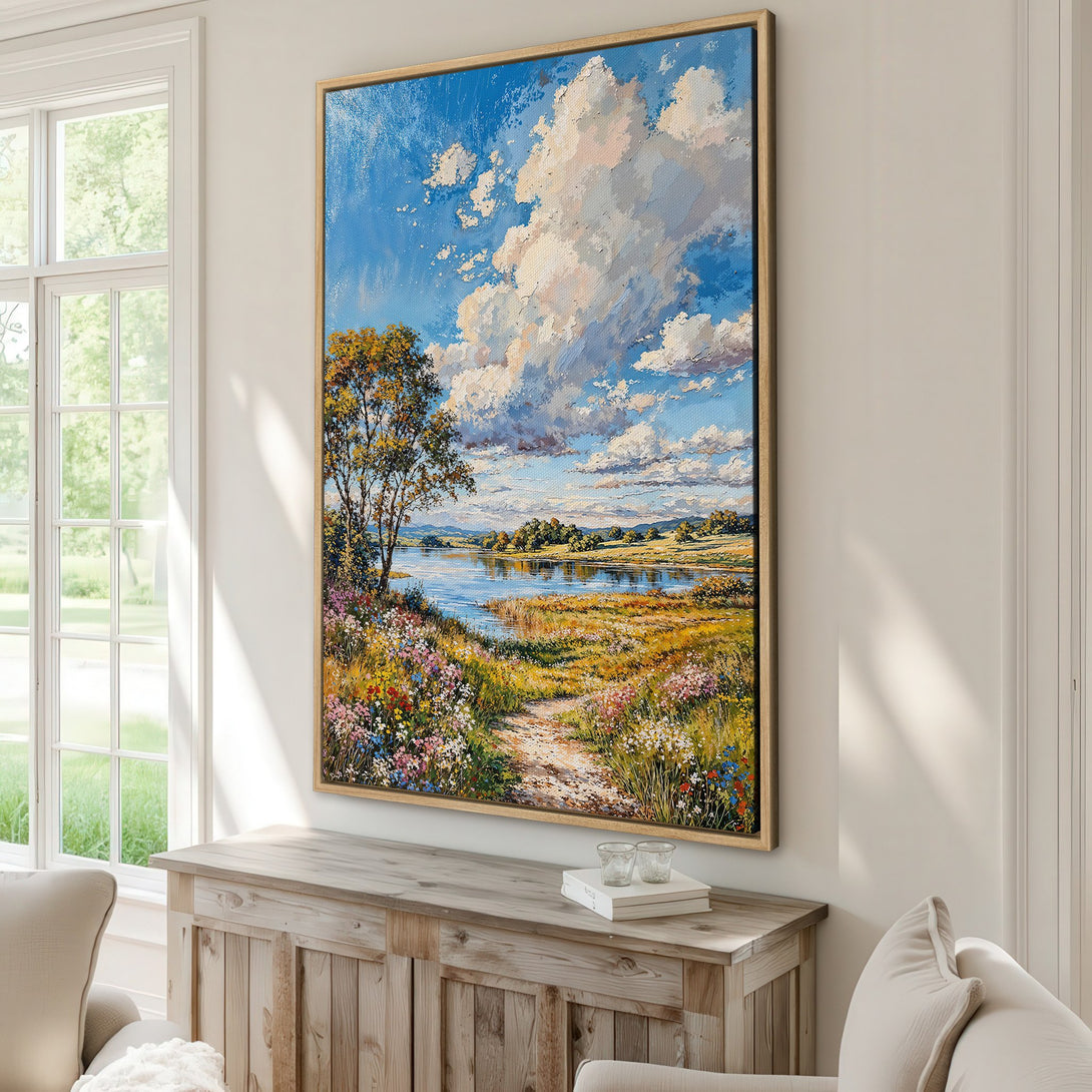 Framed Wall Art: Landscape Canvas Print with vibrant blue sky, fluffy clouds, and a serene river. Impressionistic style with warm, earthy tones. Perfect for home decor.