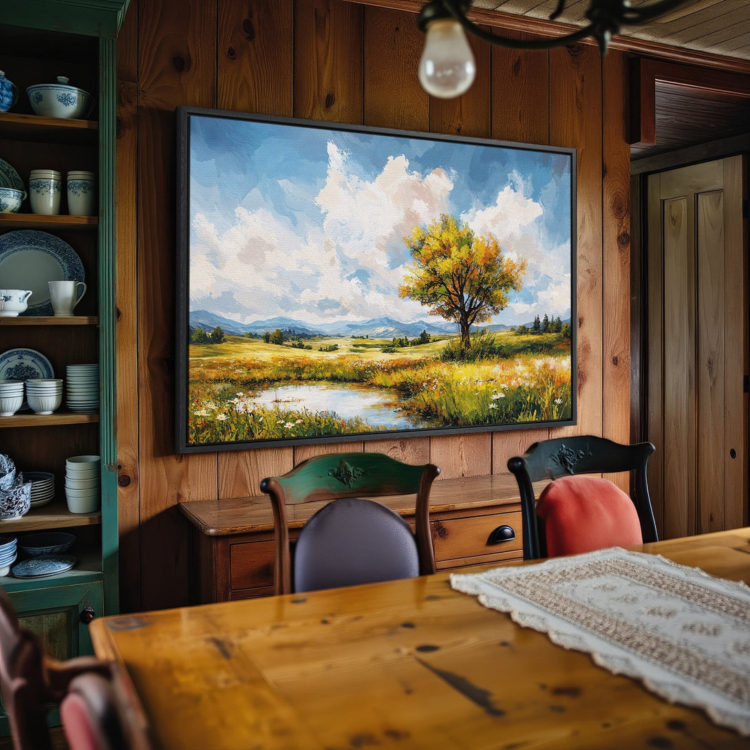 Framed Wall Art: Landscape painting with a tree and pond, featuring a blue and yellow color palette, perfect for home decor.