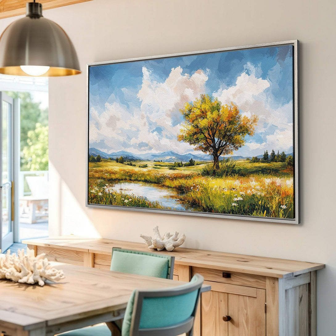 Framed Wall Art featuring a landscape painting with a tree, pond, and fields. Impressionistic style with a warm, natural color palette. Perfect for home decor.