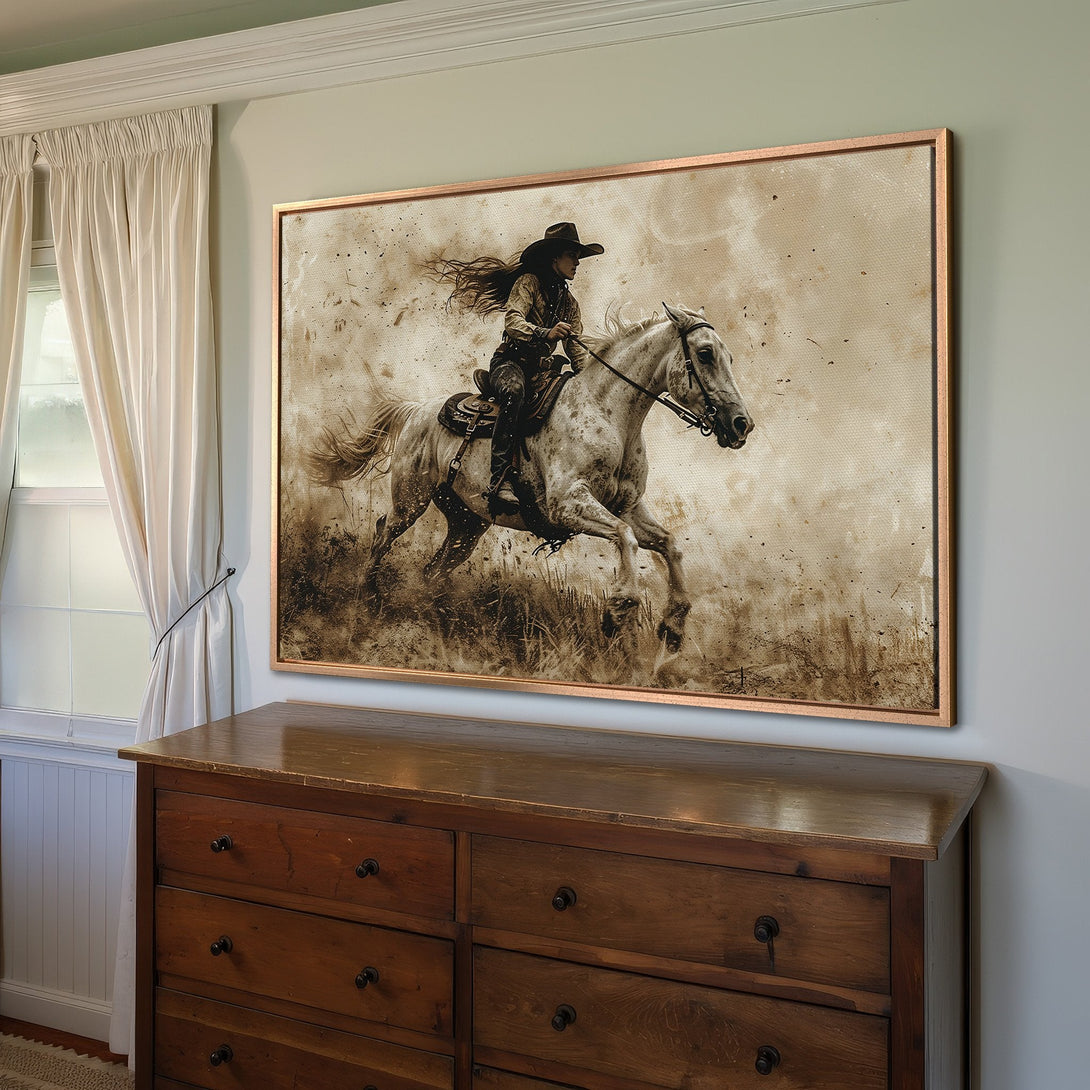 Framed Wall Art: Western-style canvas print of a cowgirl riding a horse, sepia tones. Rustic decor for your home.