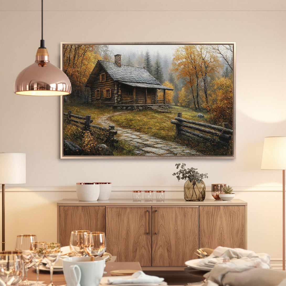 Framed Wall Art: Rustic cabin in autumn forest scene. Warm, inviting color palette with golds, browns, and greens. Perfect for cozy home decor.