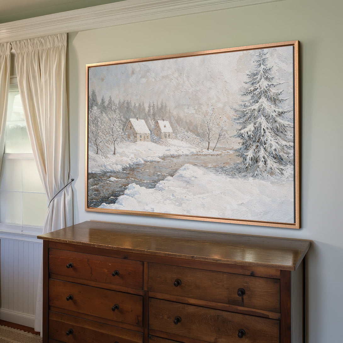 Framed Wall Art: Winter landscape Canvas Print with snowy river and cabins. Neutral color palette, perfect for cozy decor. Shop now!