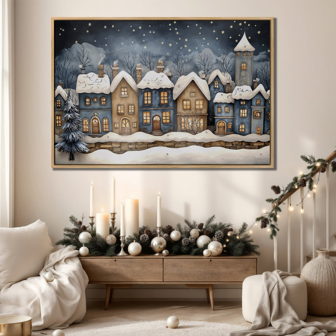 Framed Wall Art featuring a whimsical winter village scene in blue and gold tones. Perfect for adding cozy, festive charm to your home decor.