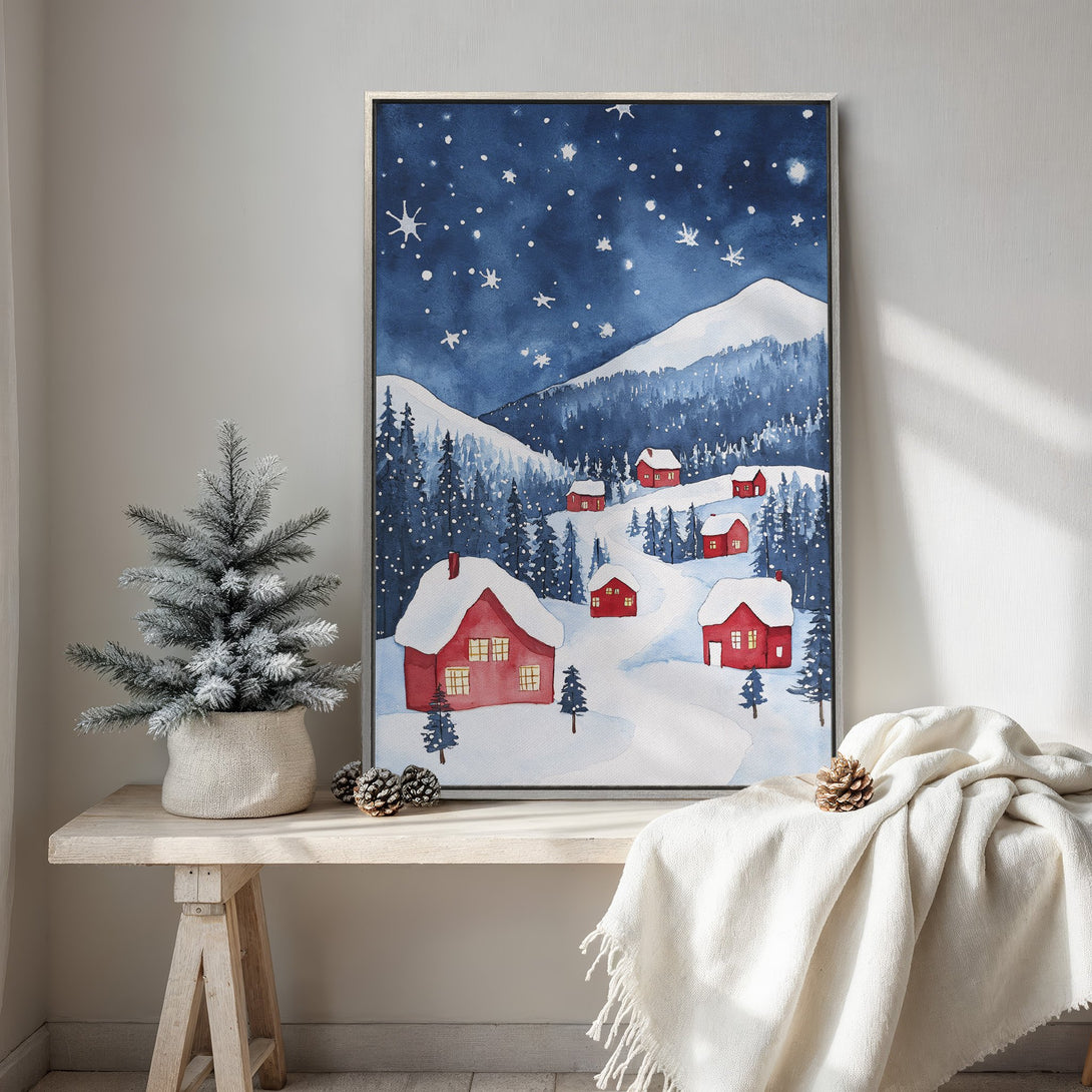 Framed Wall Art of a winter landscape with red houses and snowy mountains, watercolor style, blue and red color palette, perfect for holiday decor.