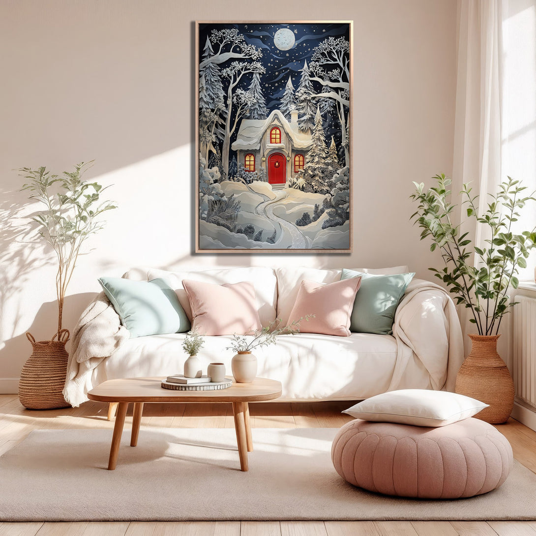 Framed Wall Art featuring a cozy winter cabin scene in a whimsical style with a cool blue and warm red color palette, perfect for home decor.