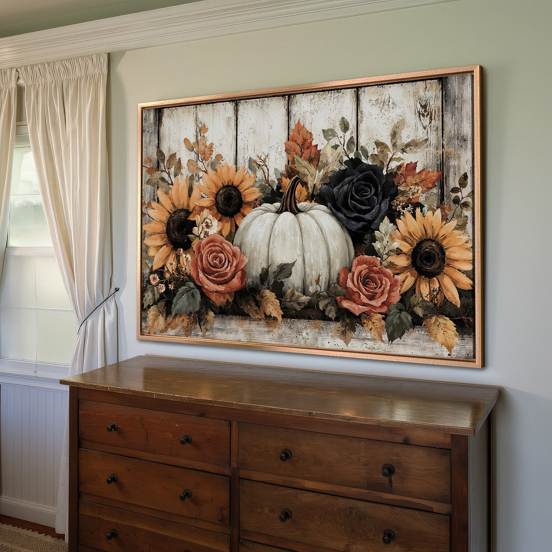 Framed Wall Art: Rustic fall floral print with pumpkin, sunflowers, and roses. Warm color palette of oranges, browns, and blacks. Perfect autumn decor.