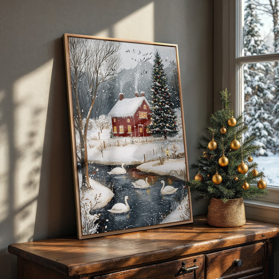 Framed Wall Art: Winter scene canvas print with red house, swans, and snowy landscape. Warm, inviting colors perfect for cozy home decor.