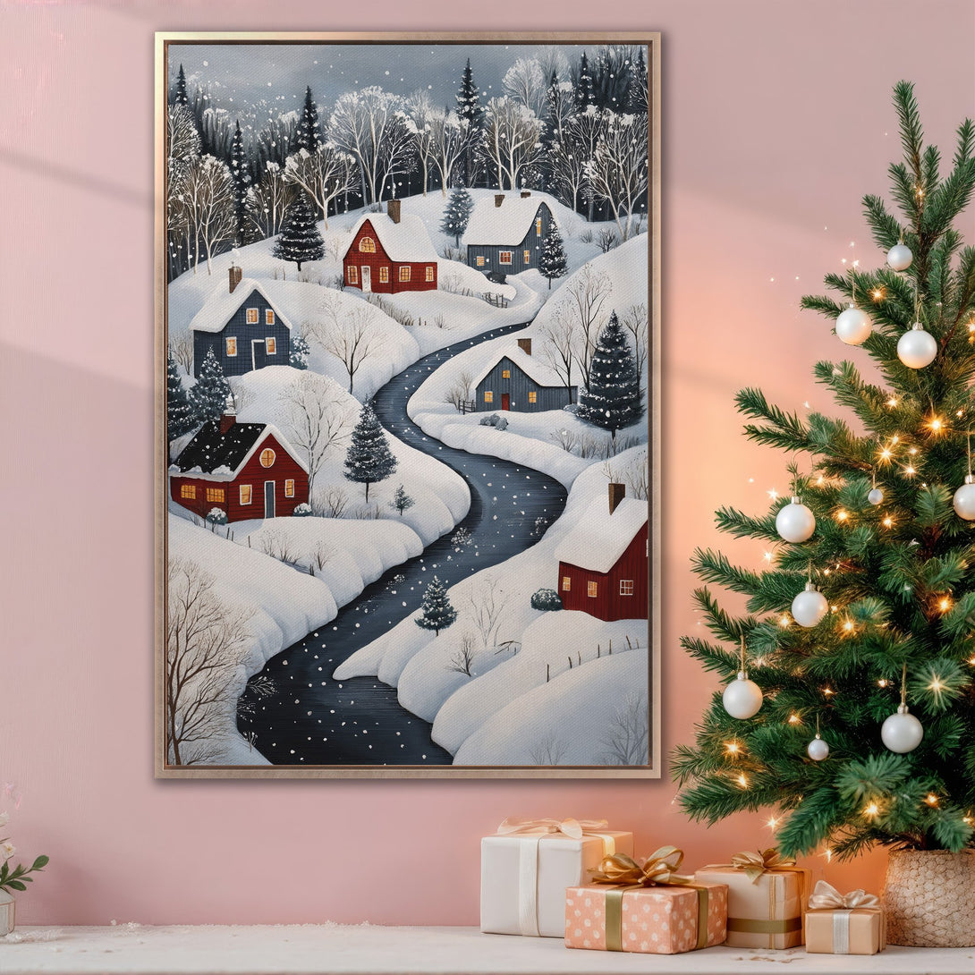 Framed Wall Art Canvas Print of a winter village scene with red houses, snowy landscape, and a cool blue and white palette. Perfect for holiday decor.