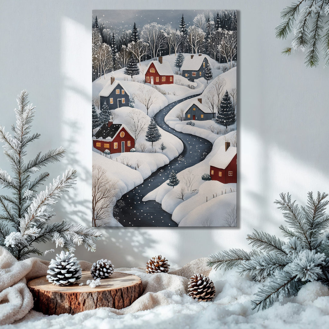Framed Wall Art: Winter village scene canvas print with red houses, snow, & river. Cozy decor in a wintery, blue & white palette. Perfect for Christmas!
