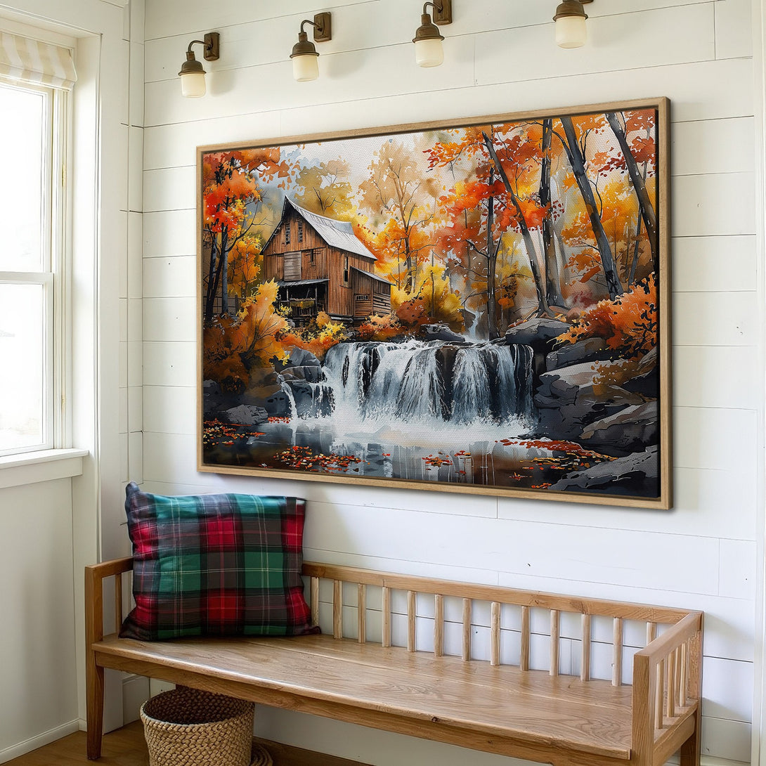 Framed Wall Art: Watercolor landscape of a barn and waterfall in fall colors. Warm orange, yellow, and brown tones create a cozy, rustic aesthetic.