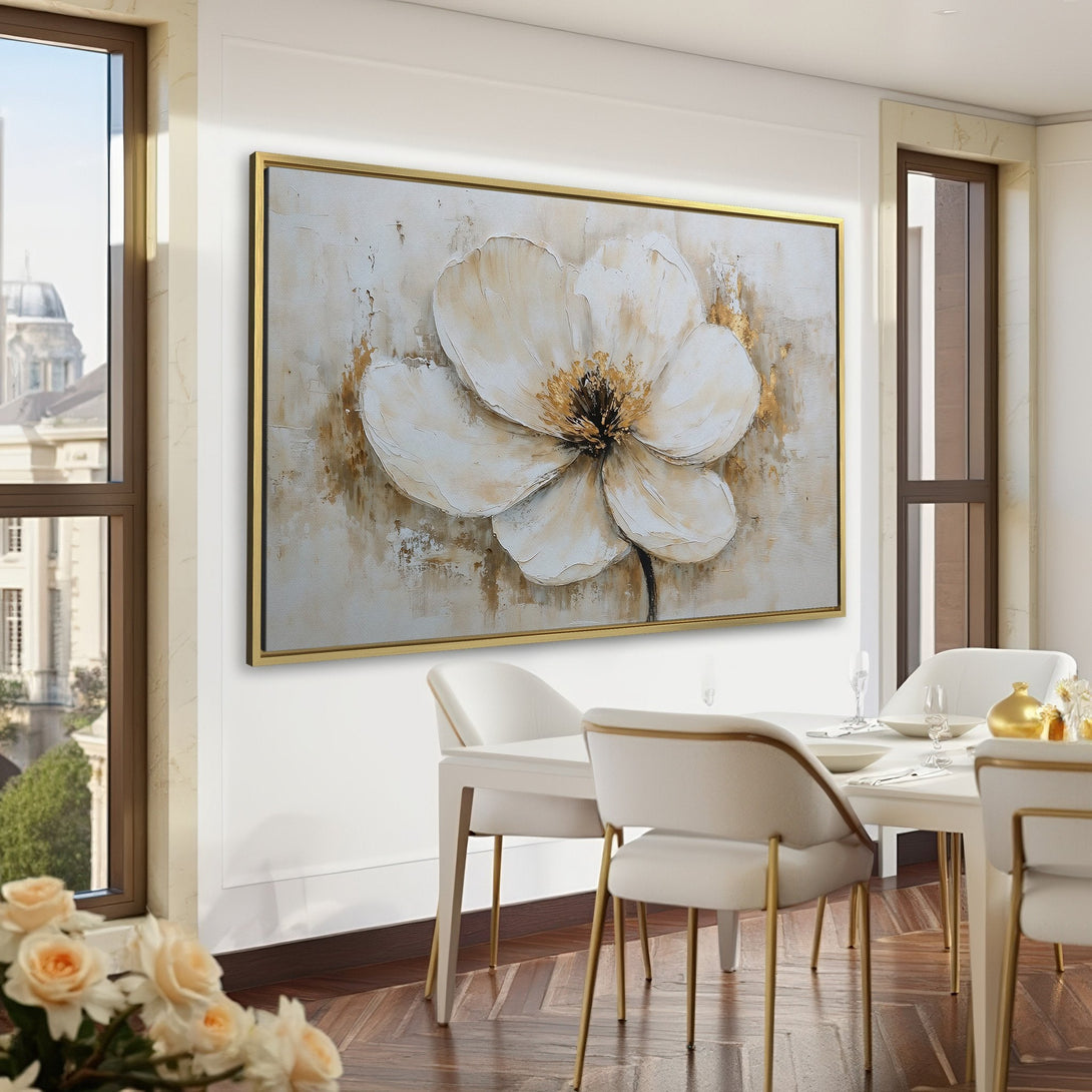 Canvas Print of a large white flower painting with gold accents, displayed in a green-walled room. Elegant, neutral color palette.