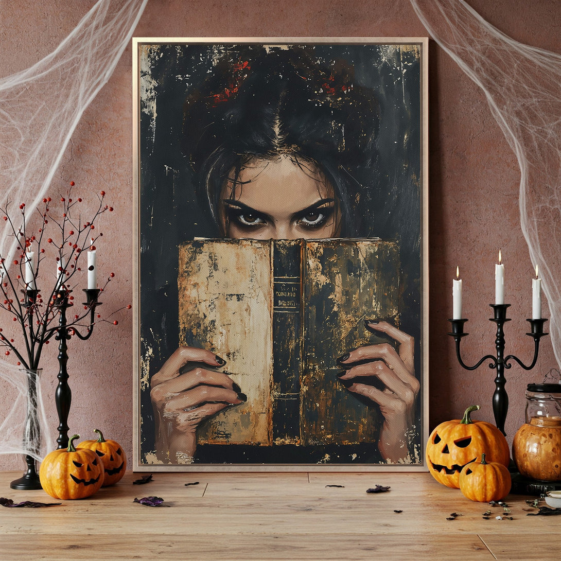 Framed Wall Art: Dark, gothic portrait of a woman with piercing eyes, holding an old book. Moody, dramatic style with a black, gold, and brown color palette. Perfect for Halloween!