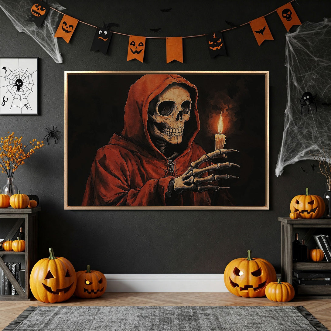 Framed Wall Art: Spooky skull in red robe holding candle. Dark, moody art with orange and black Halloween decor. Perfect for a Halloween-themed interior.