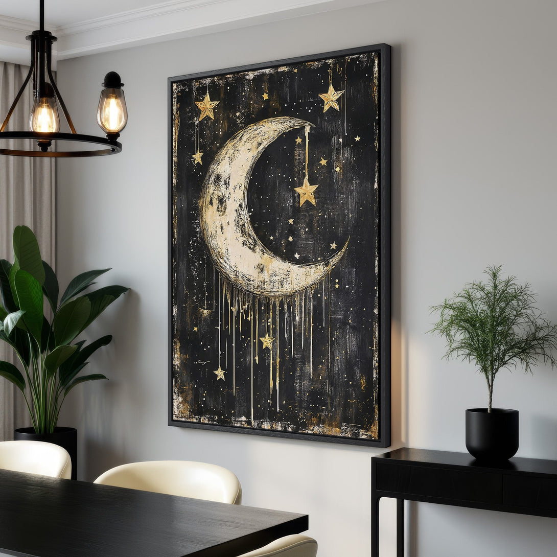 Framed Wall Art featuring a celestial moon and stars design in gold and black, adding a touch of modern elegance to any space.
