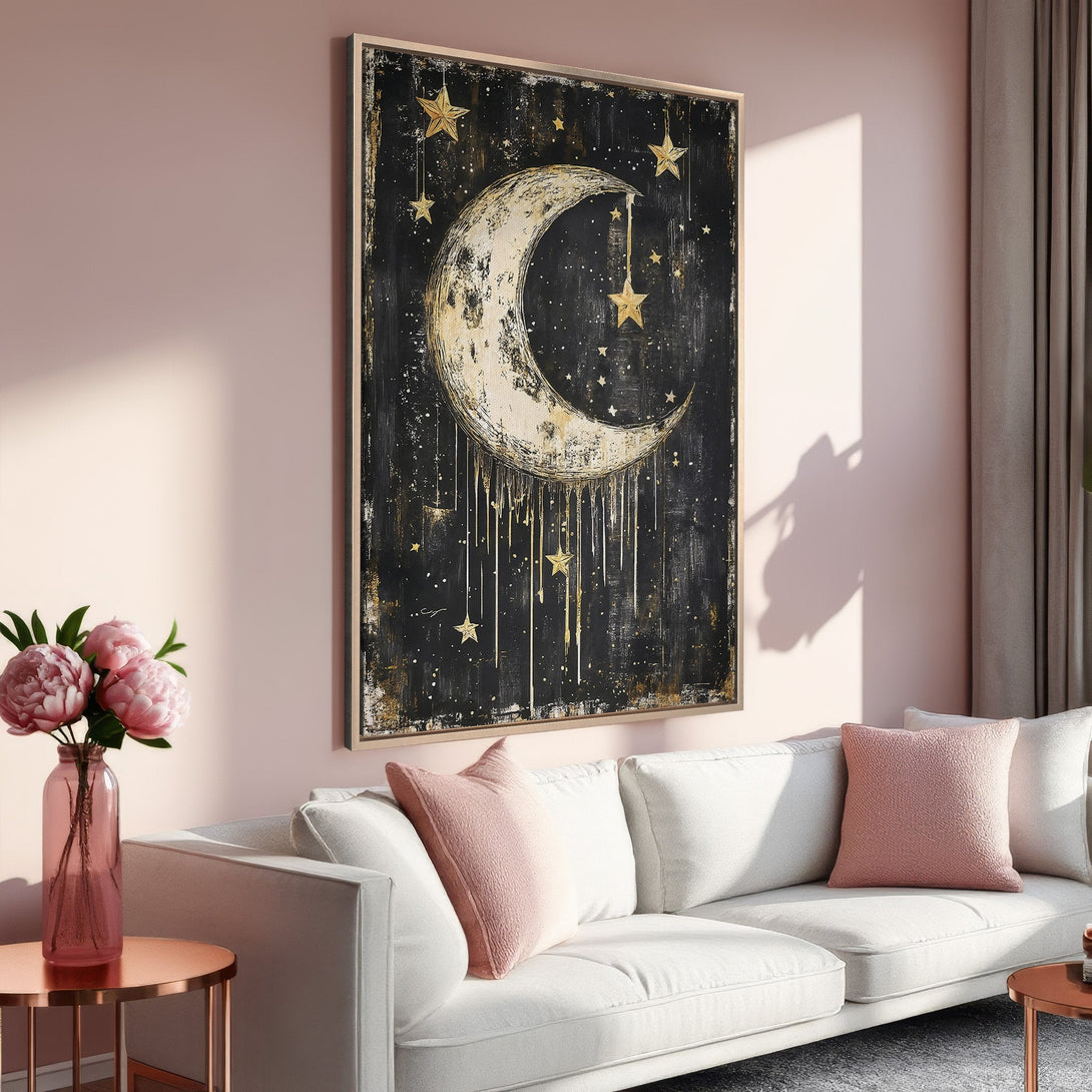 Framed Wall Art featuring a celestial moon and stars design in black and gold. Modern abstract style, perfect for a chic home decor update.