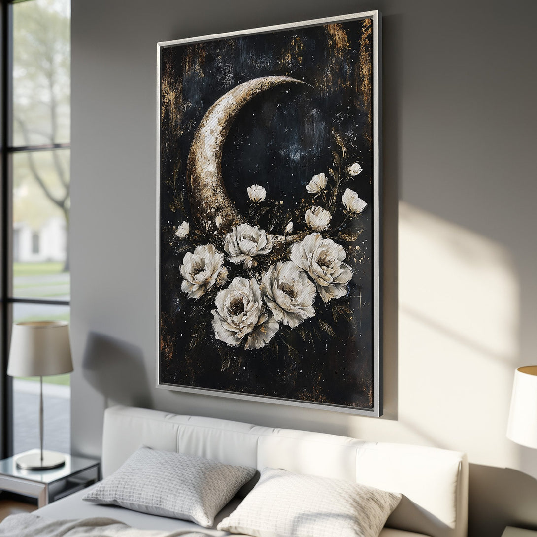 Framed Wall Art: Moon and floral art print in a bedroom. Dark, moody style with white flowers and gold accents on a black background. Modern home decor.