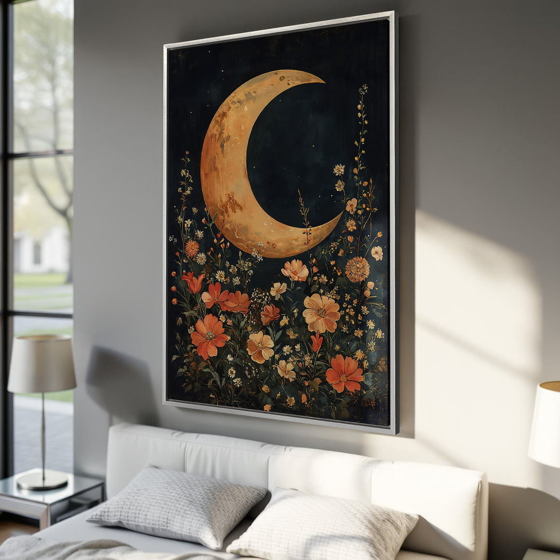 Framed Wall Art featuring a crescent moon and floral arrangement. Warm orange and gold hues pop against a dark, moody background. Perfect for bedroom decor.