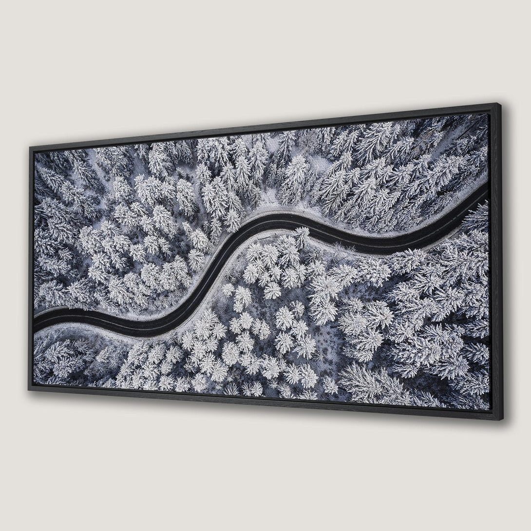 Framed Wall Art of a snowy forest road. Modern landscape art in a cool, blue and white color palette. Perfect for your home decor.