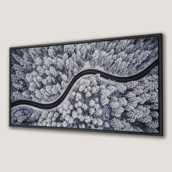 Framed Wall Art of a snowy forest road. Modern landscape art in a cool, blue and white color palette. Perfect for your home decor.