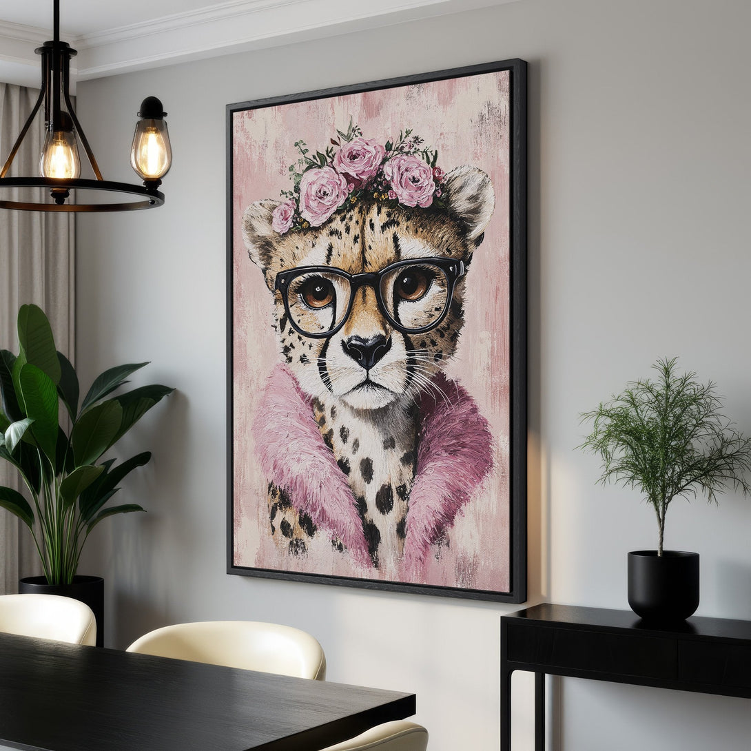 Framed Wall Art featuring a stylish cheetah wearing glasses and a floral crown. Soft pink and neutral tones create a chic, modern aesthetic. Perfect for home decor!