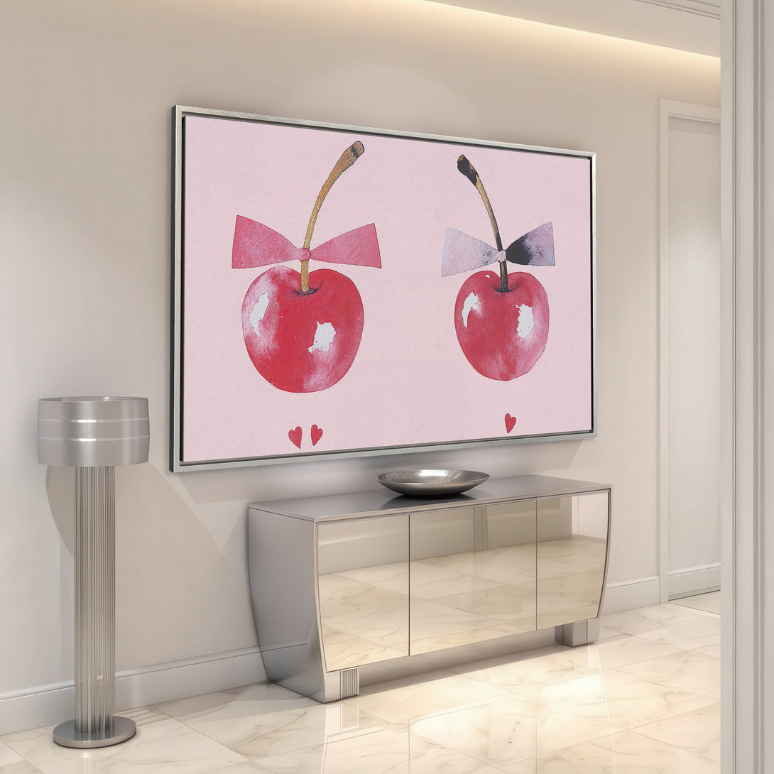 Framed Wall Art featuring watercolor cherries with bows in a pink and red palette. Perfect for adding a touch of whimsy to your home decor.