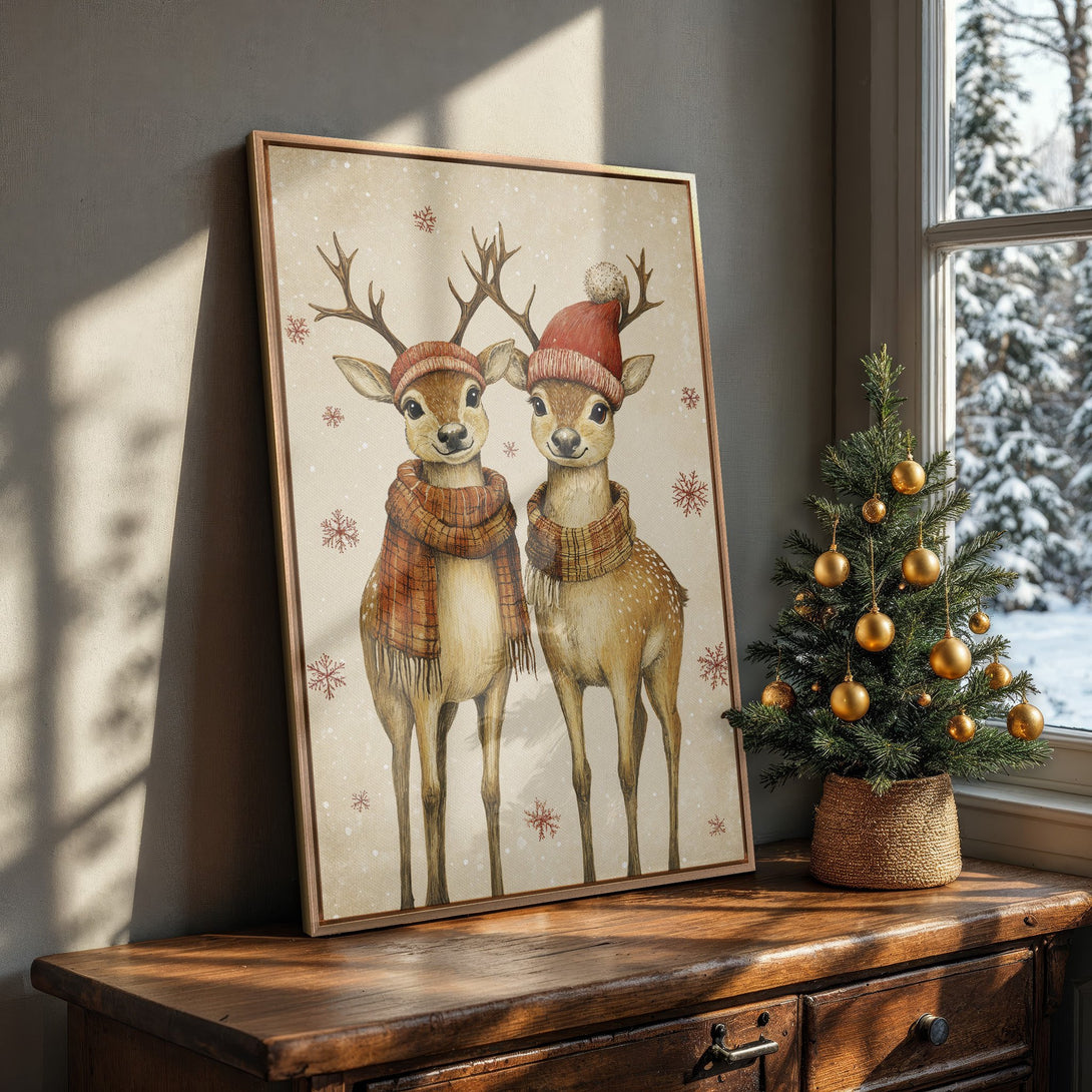 Framed Wall Art featuring adorable watercolor deer in winter hats and scarves. Warm, neutral color palette perfect for cozy holiday decor.