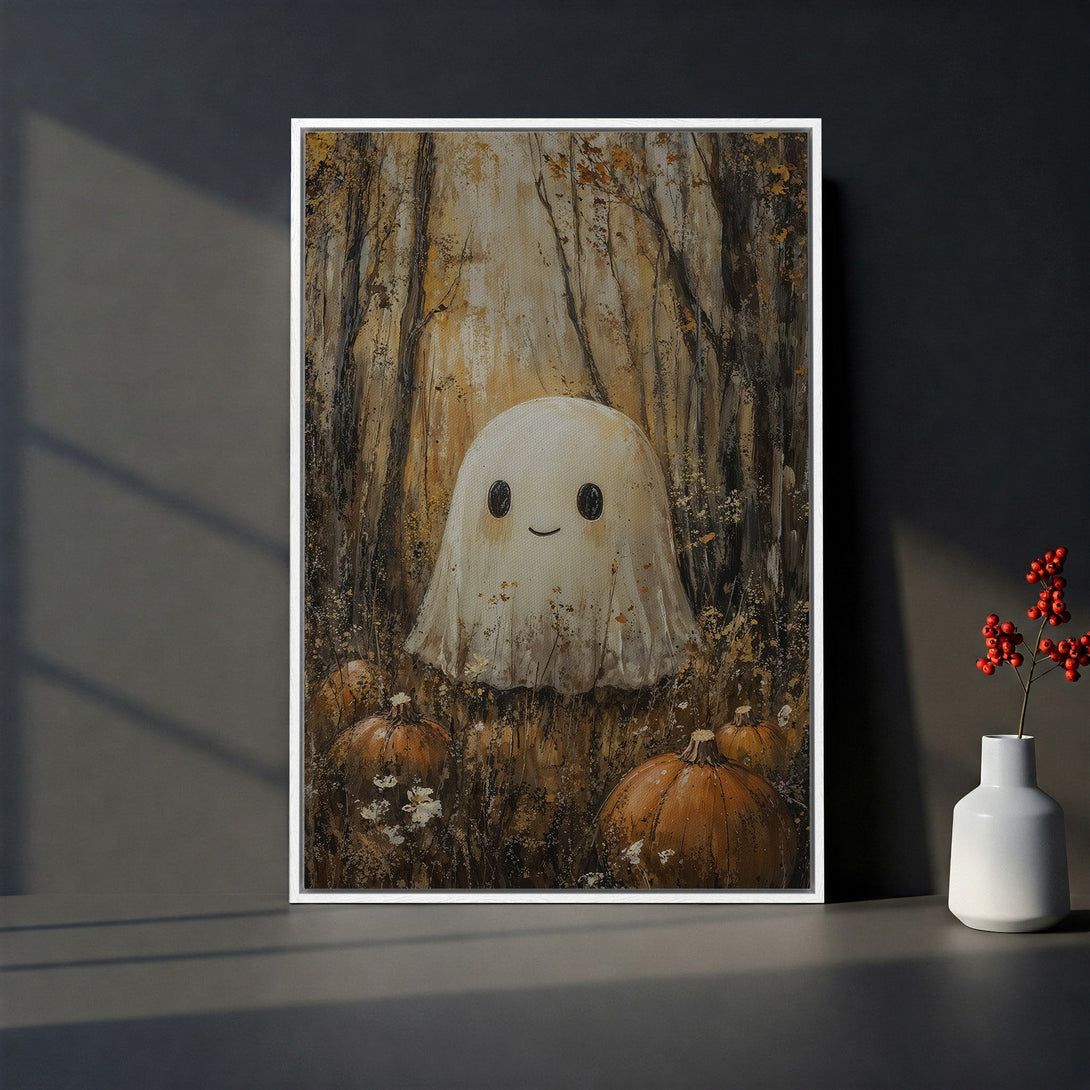 Framed Wall Art featuring a friendly ghost in a forest scene with pumpkins, warm autumnal color palette. Perfect Halloween decor!