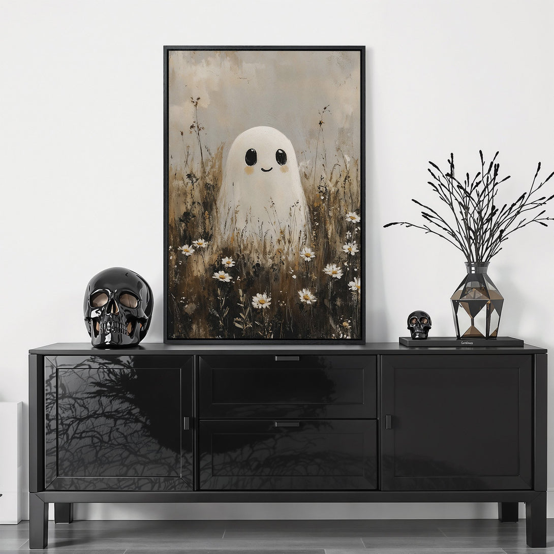 Framed Wall Art featuring a cute ghost in a field. Neutral color palette with black frame. Perfect for Halloween decor!