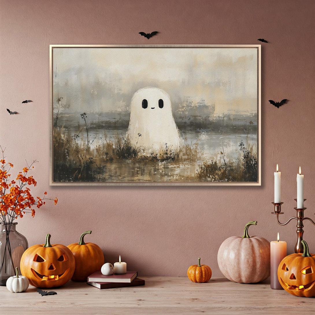 Framed Wall Art: Whimsical ghost painting in neutral tones, perfect for Halloween decor. Adds a touch of spooky charm to any space.